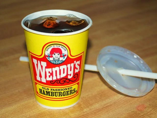 Classic yellow Wendy's cup with the vintage Old Fashioned Hamburgers design